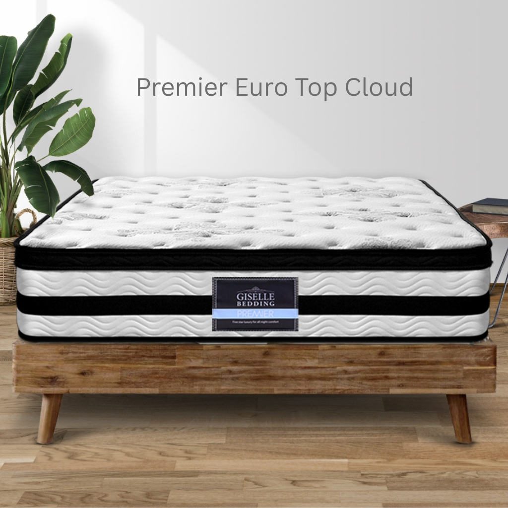 Giselle Bedding Premier Euro Top Cloud mattress on a wooden bed frame with a plant in the background.